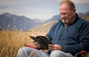 father reading Bible
